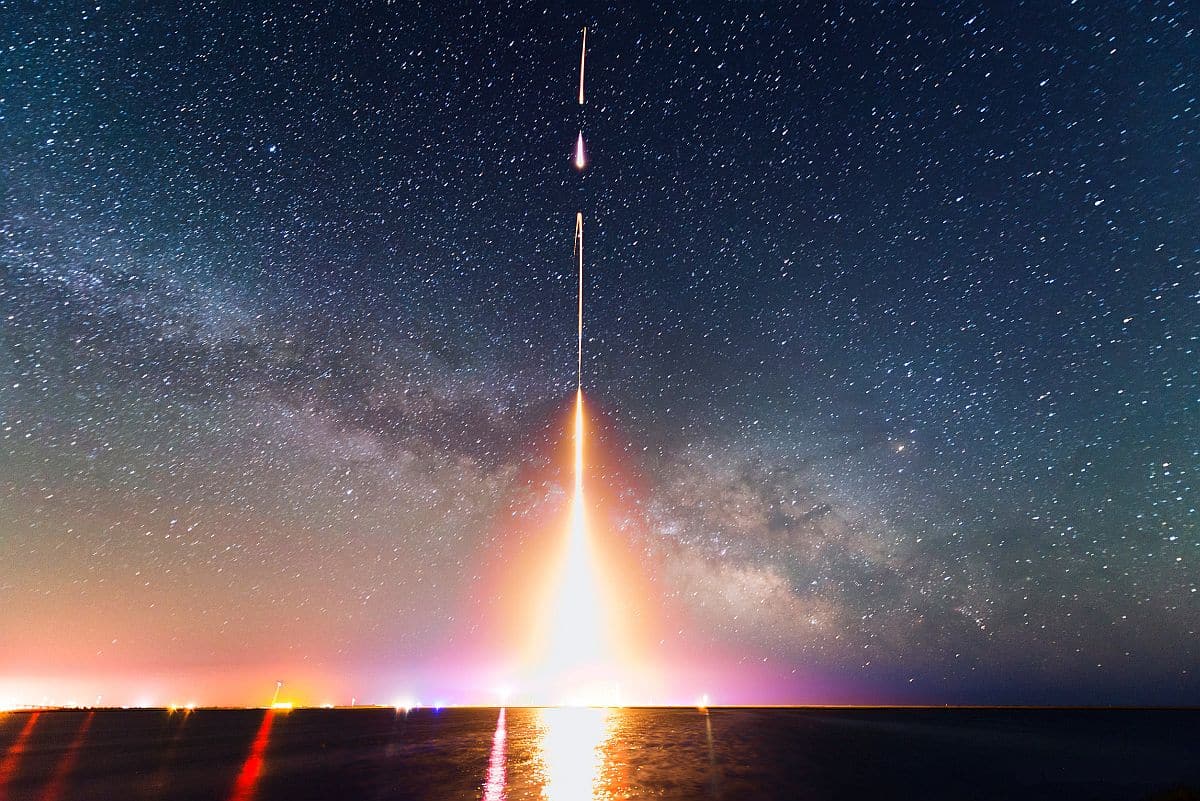 Time-lapse photograph of rocket launch; digital transformation in banking concept