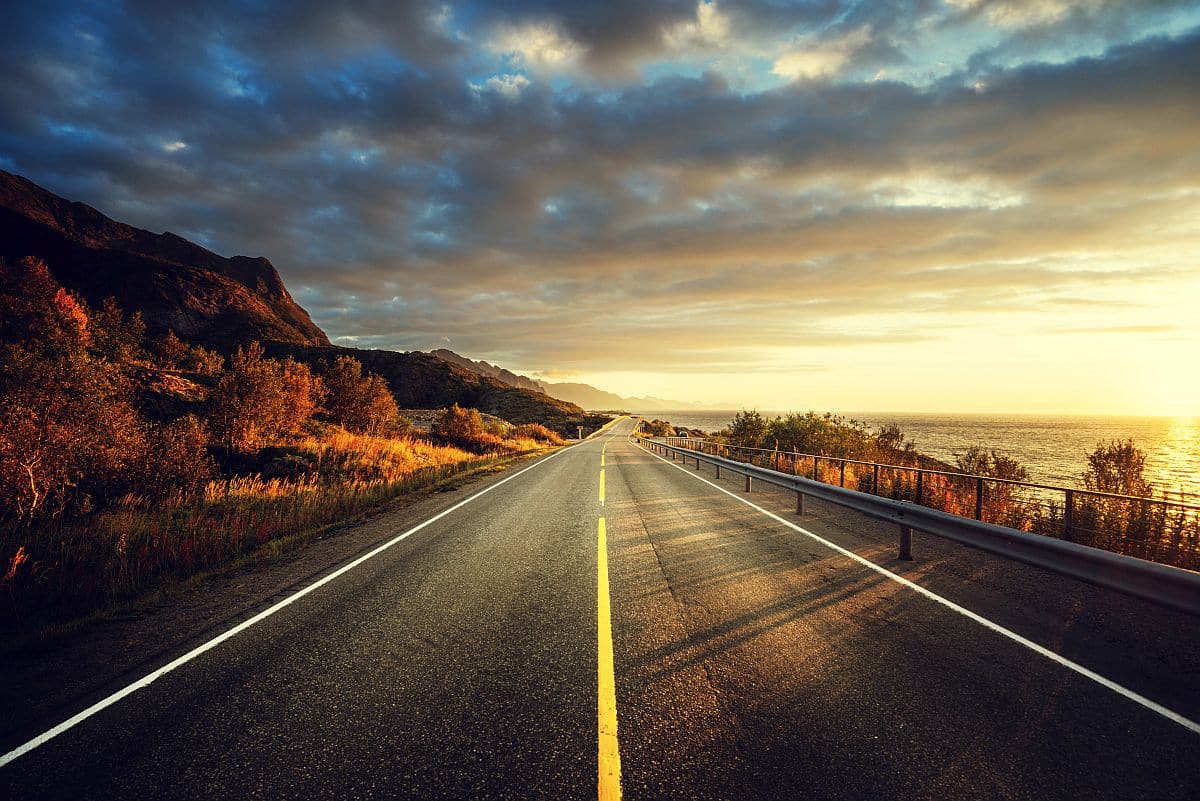 road by the sea at sunrise; Oil and Gas Industry Hiring concept