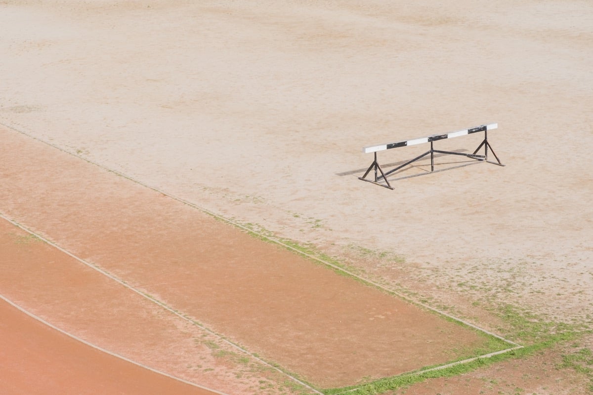hurdle on an empty running track; talent management challenges for life sciences