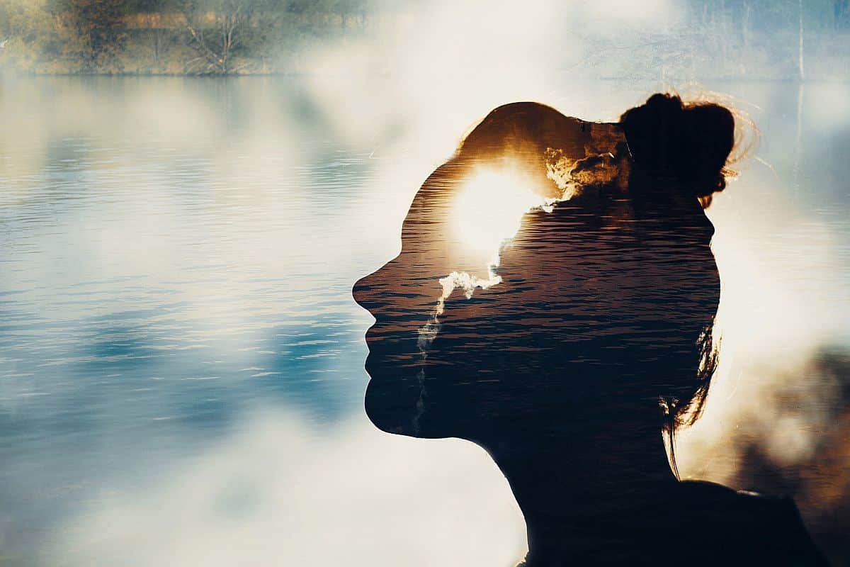 silhouette of a female face reflected in water; Talent Management Employee Expectations concept