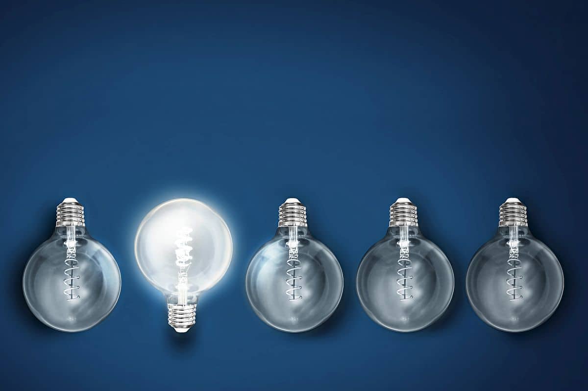 illuminated light bulb in a row of dim ones; Talent Rediscovery concept